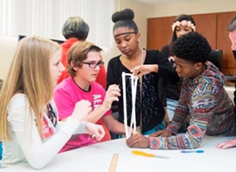 Girls engaged in STEM activities